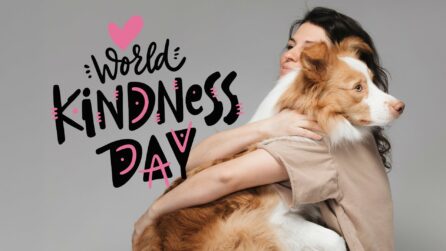 Una ragazza abbraccia un cane, accanto la scritta World Kindness Day - Giornata Mondiale della Gentilezza